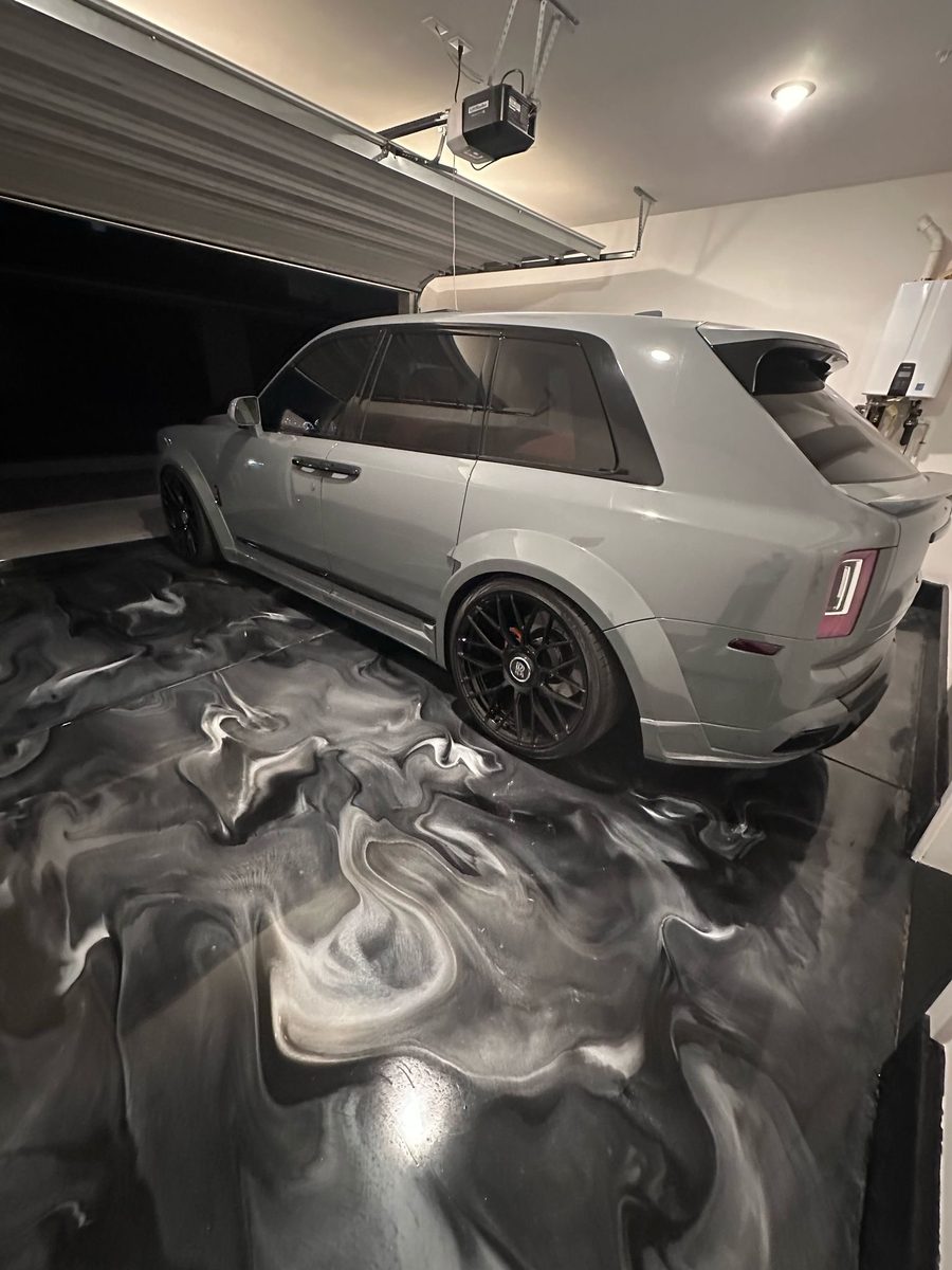 Rolls Royce Cullinan on dark charcoal epoxy floor